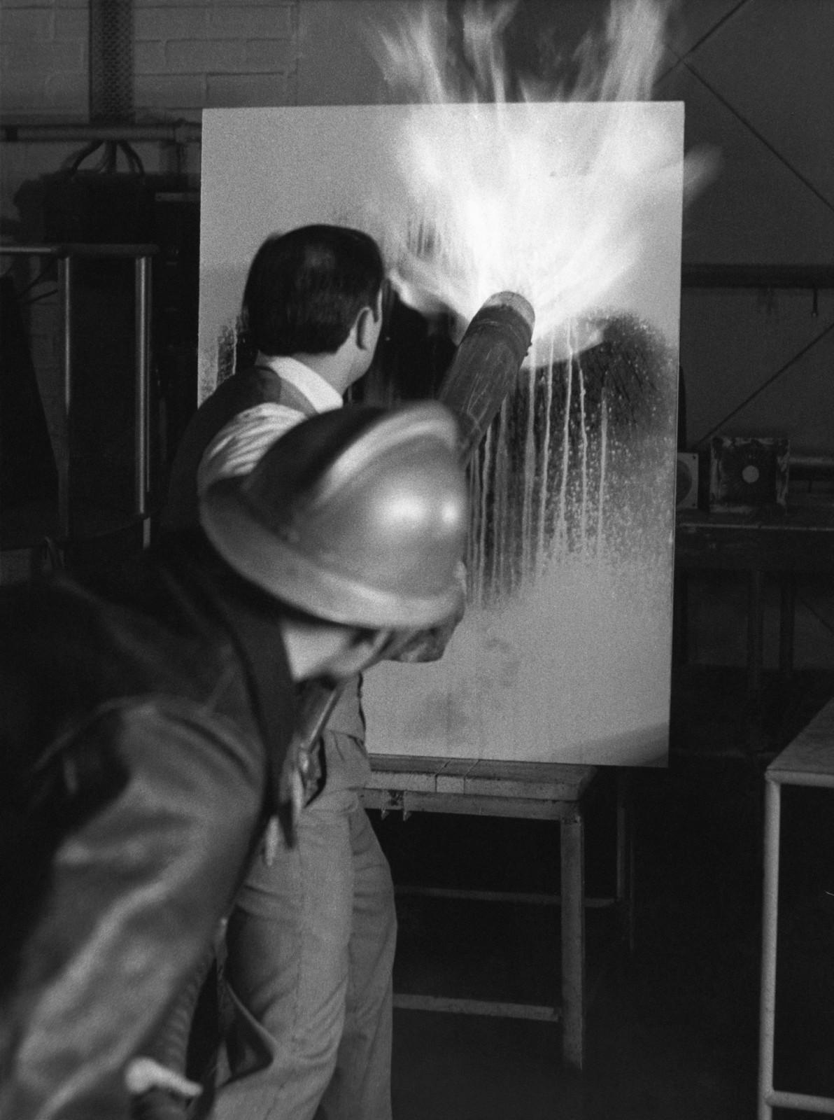 Yves Klein realizing a Fire Painting (F 71)