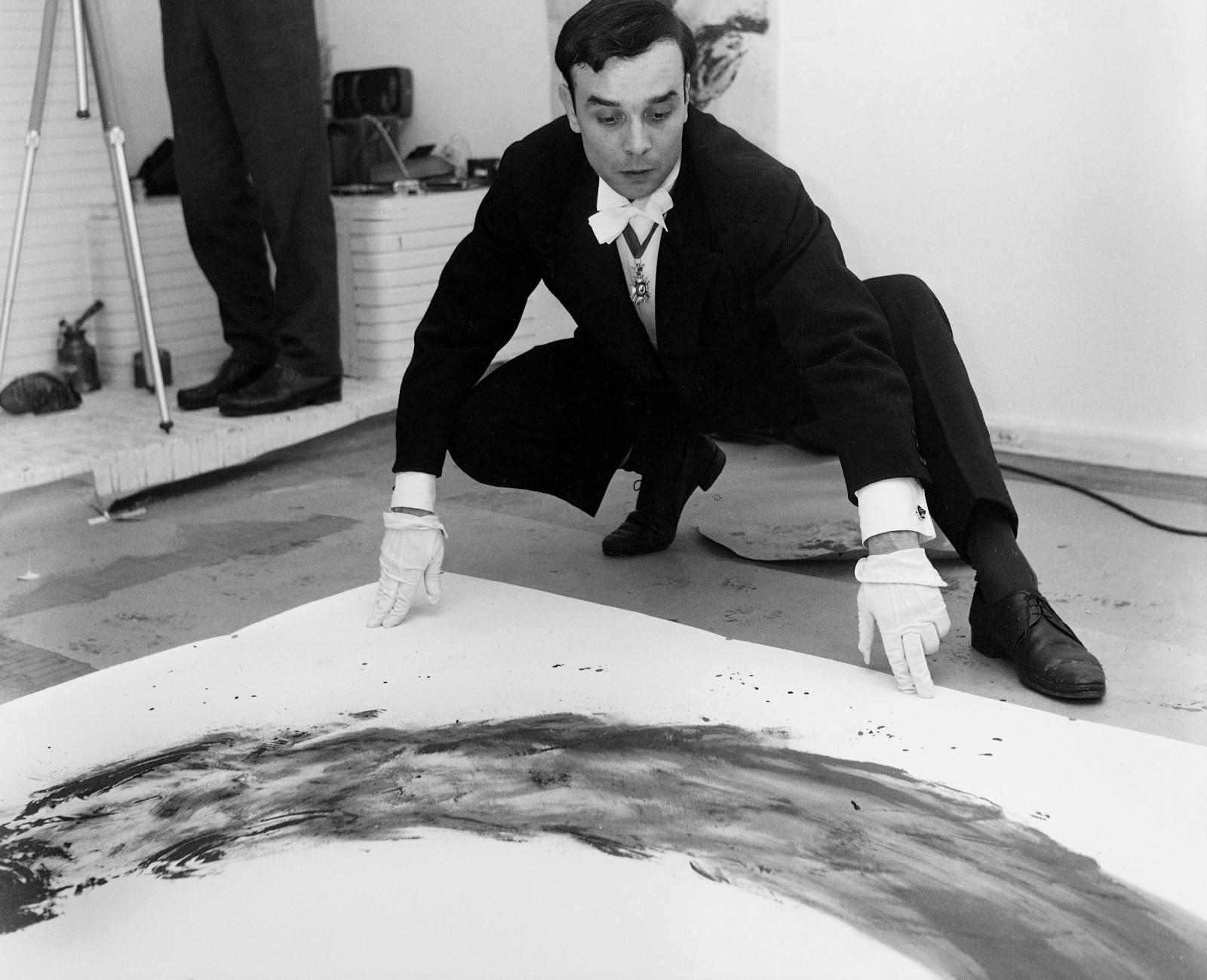 Yves Klein realizing an Anthropometry in his studio (ANT 111)