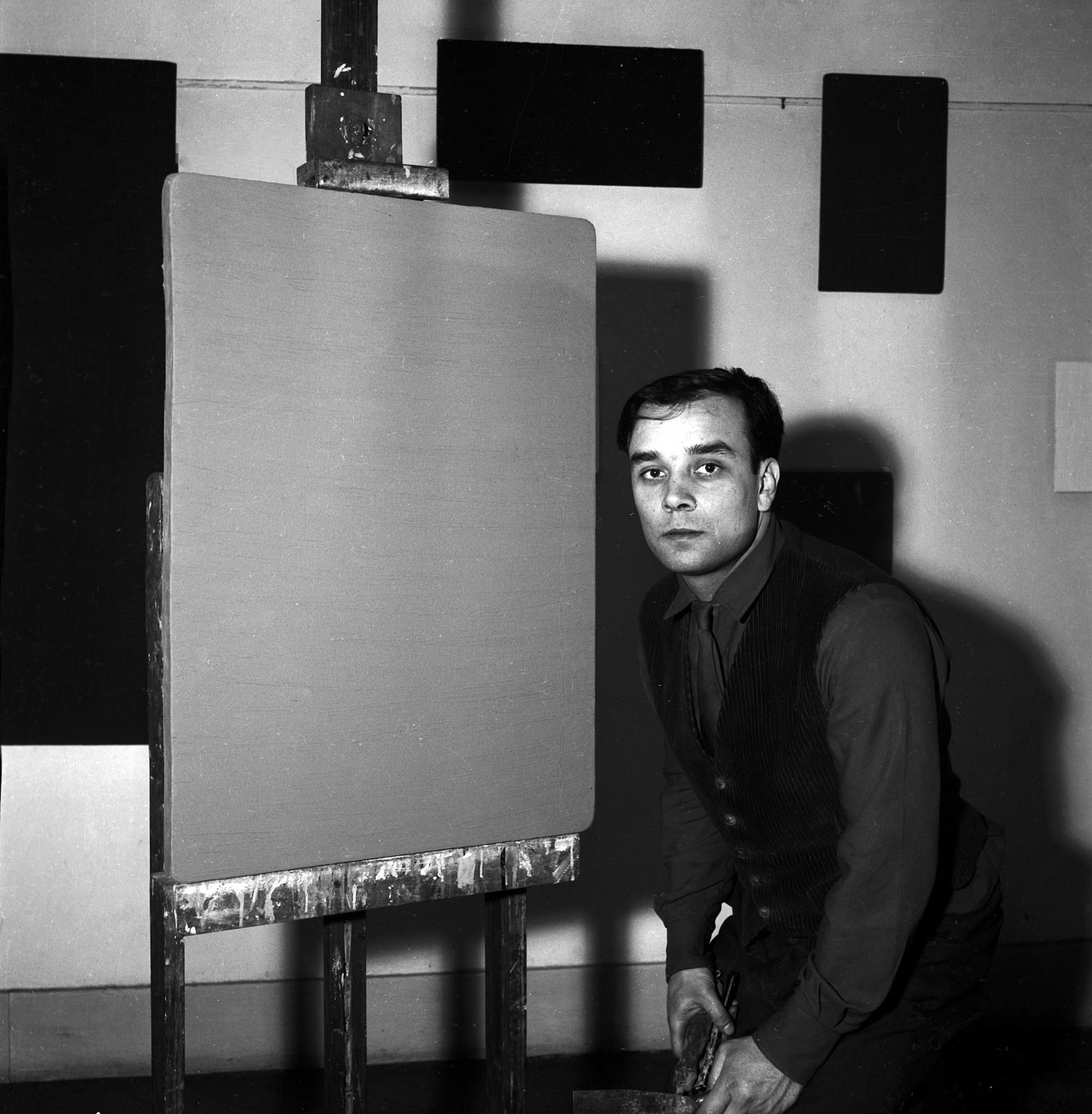 Portrait of Yves Klein in front of his Monochromes
