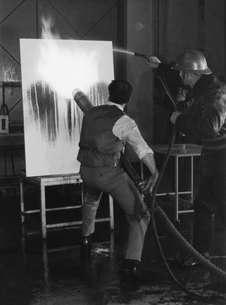 Yves Klein realizing a Fire Painting (F 71)