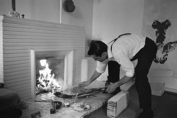 Yves Klein realizing a Fire Painting (F 136)
