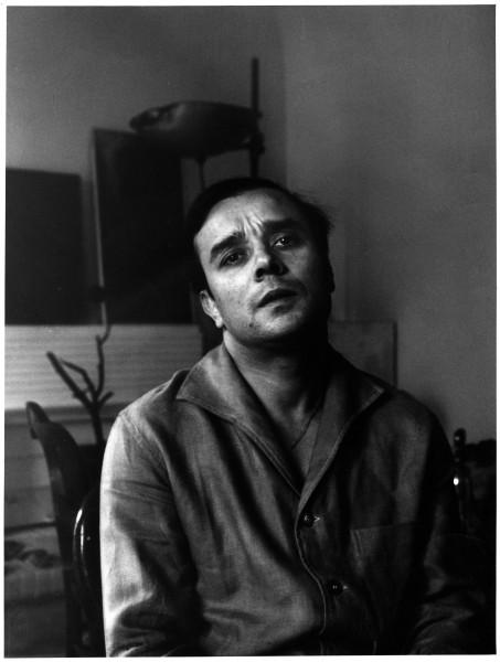 Portrait of Yves Klein in his apartment