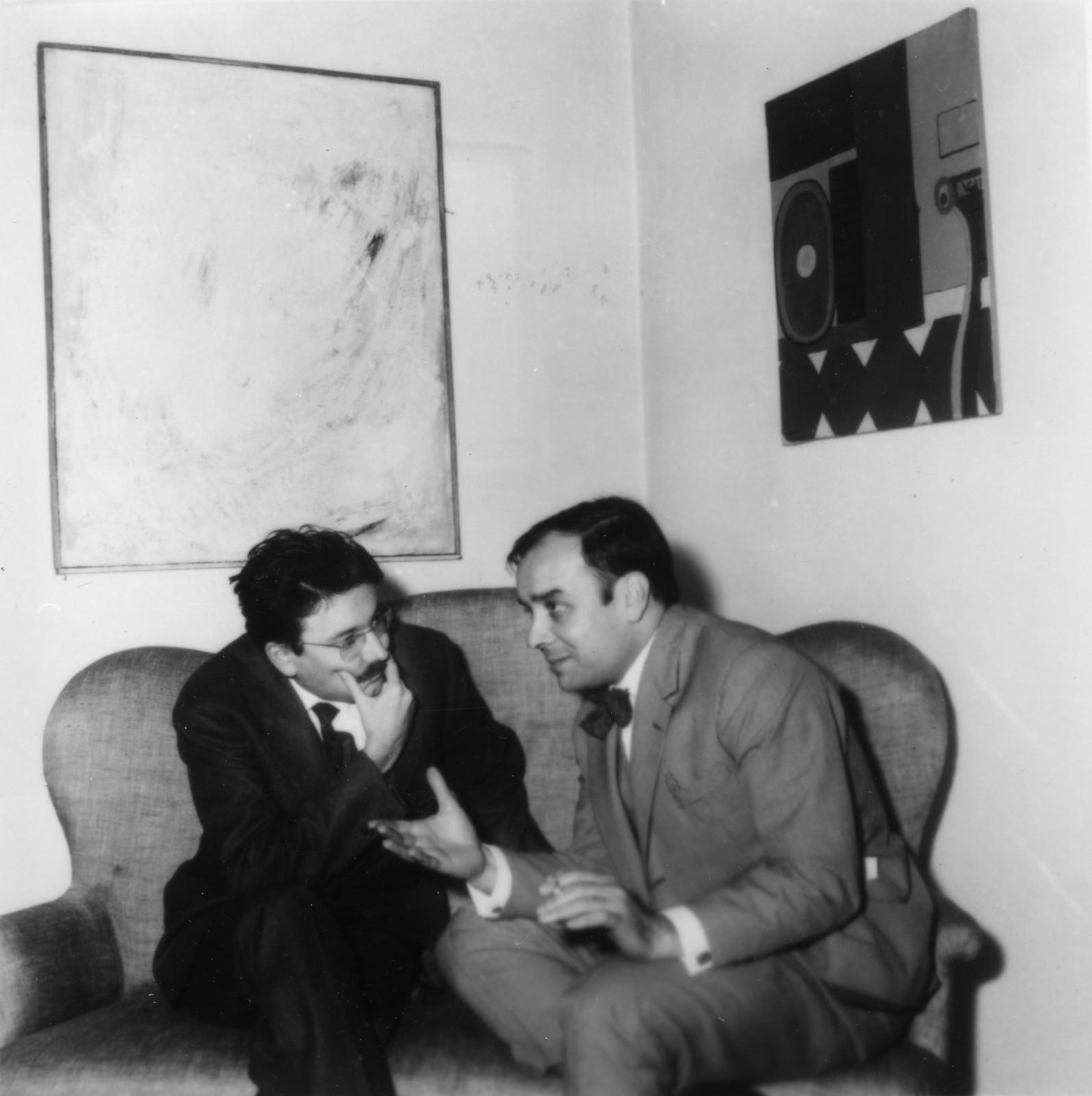 Pierre Restany and Yves Klein during the opening of the exhibition "Yves Klein le monochrome: il nuovo realismo del colore", Apollinaire Gallery, Milano, 1961