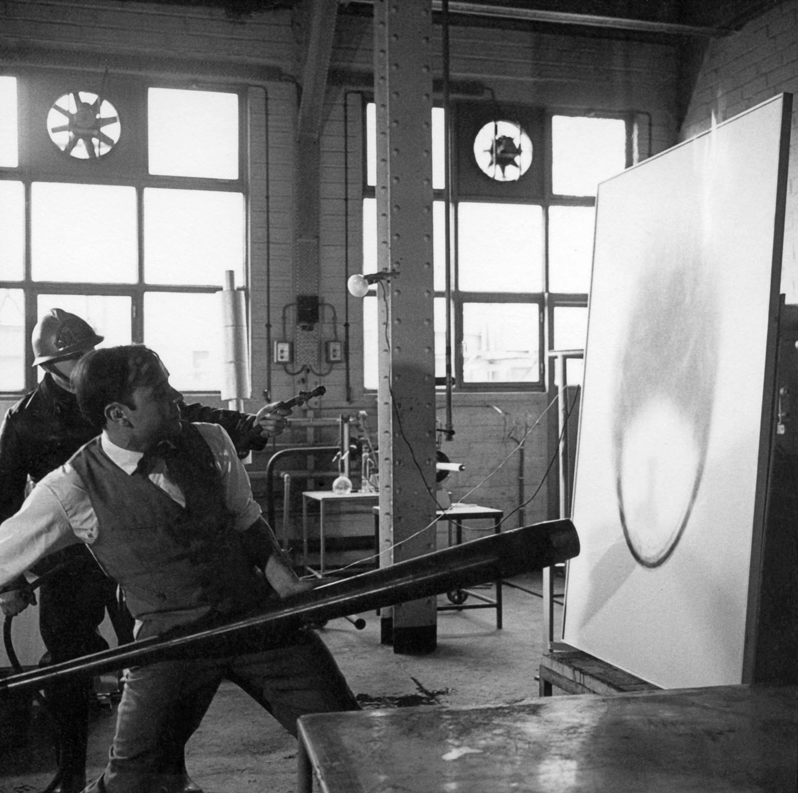 Yves Klein realizing a Fire Painting (F 3)