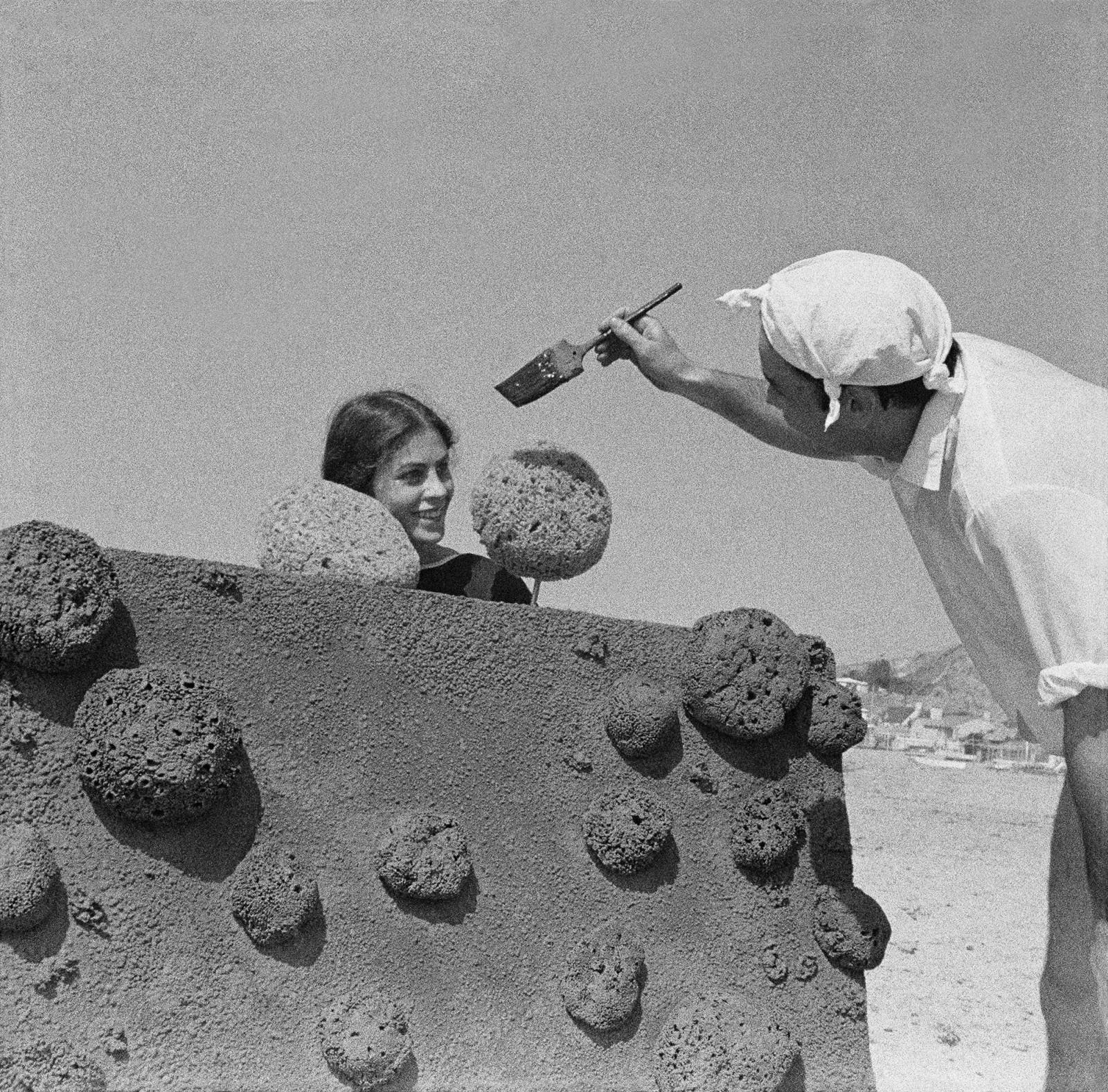 Yves Klein making a Sponge Relief on Malibu beach with Rotraut (RE 28)