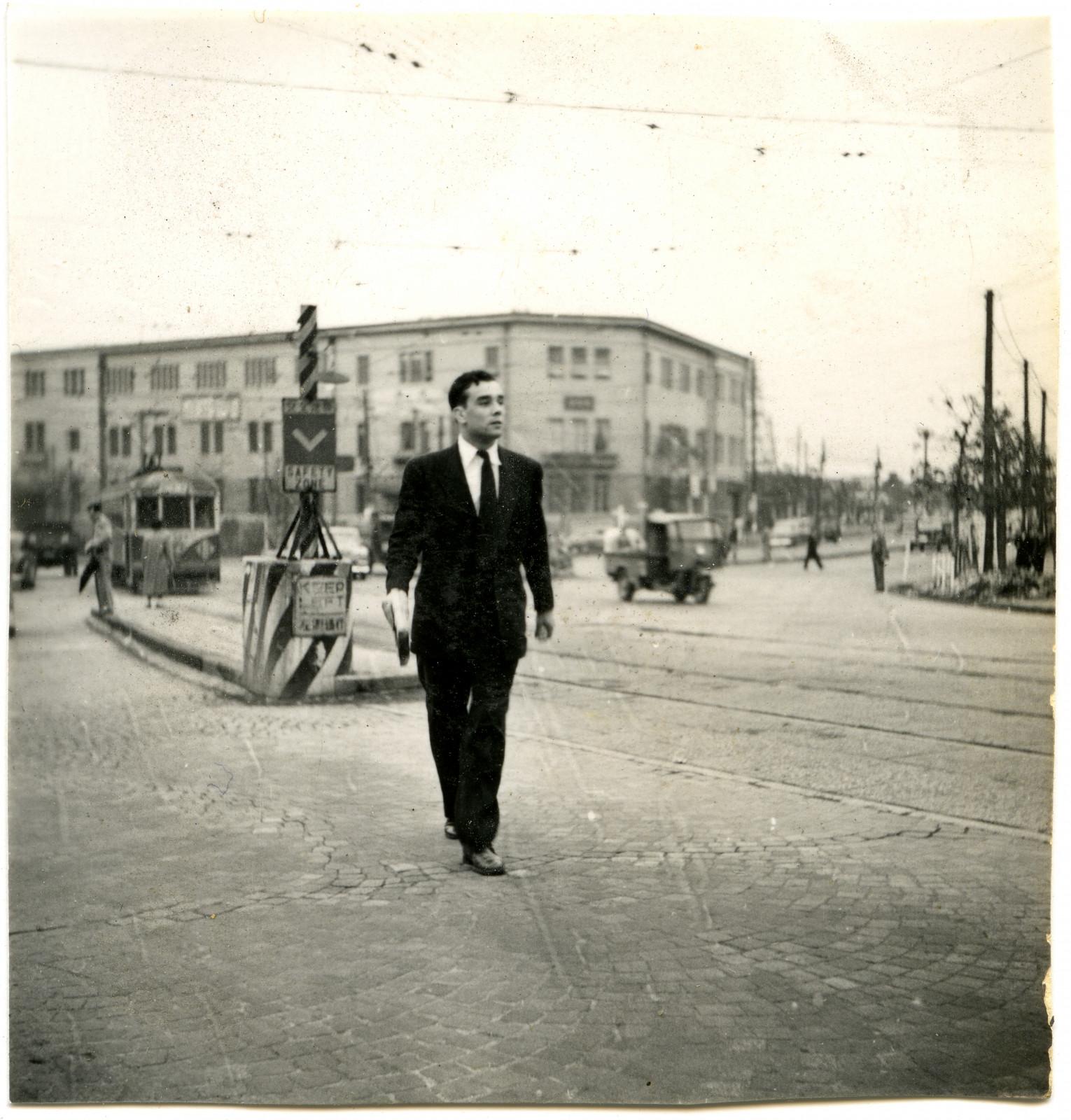 Yves Klein in front of the Kôdôkan Judo Institute, Tokyo