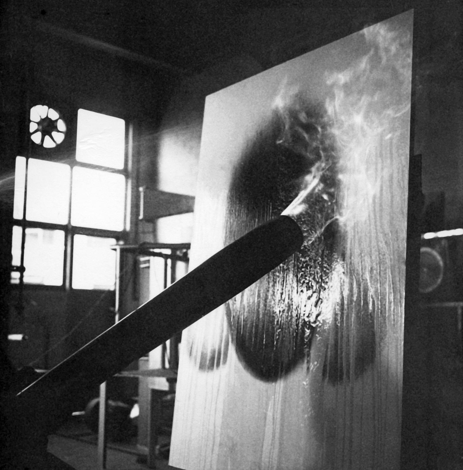 Yves Klein realizing a Fire Painting (F 2)
