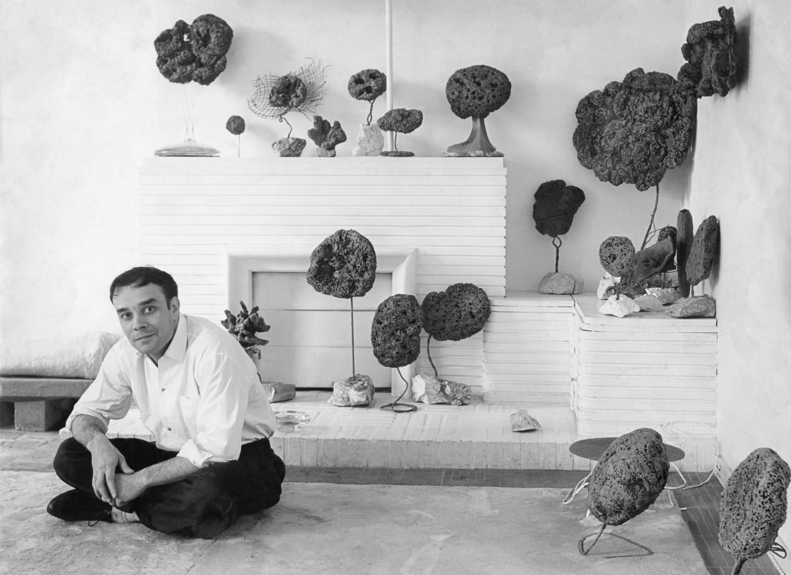 Yves Klein in his studio surrounded by his Sponge Sculptures