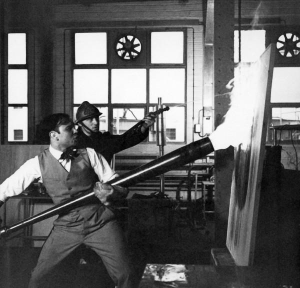 Yves Klein realizing a Fire Painting (F 2)