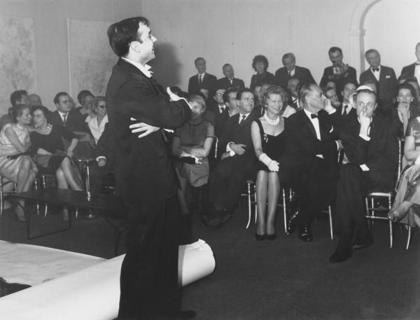 Yves Klein during the presentation of the "Anthropométries de l'Époque Bleue" at the Galerie Internationale d'Art Contemporain