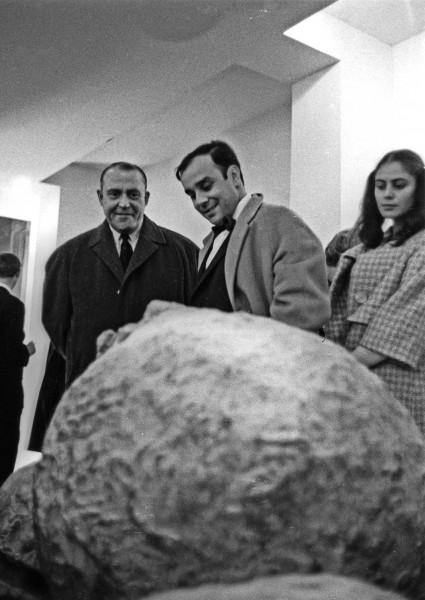 Yves Klein at the opening of the exhibition "Concetti spaziali" by Lucio Fontana at Galerie Iris Clert