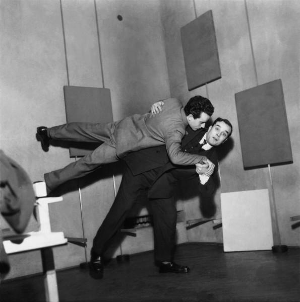 Yves Klein making a Judo catch during his exhibition "Yves Klein: Proposte monocrome, epoca blu", Galleria Apollinaire