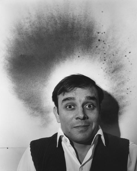 Yves Klein in front of his Fire Painting (F 85)