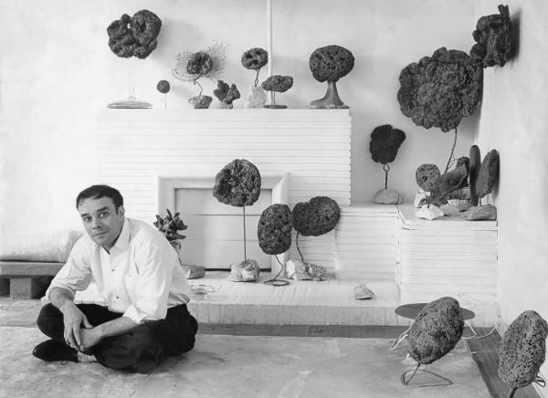 Yves Klein in his studio surrounded by his Sponge Sculptures